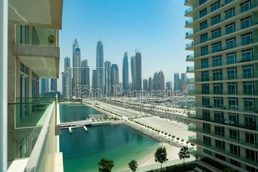 Buy a property - Emaar Beachfront, UAE - image 33